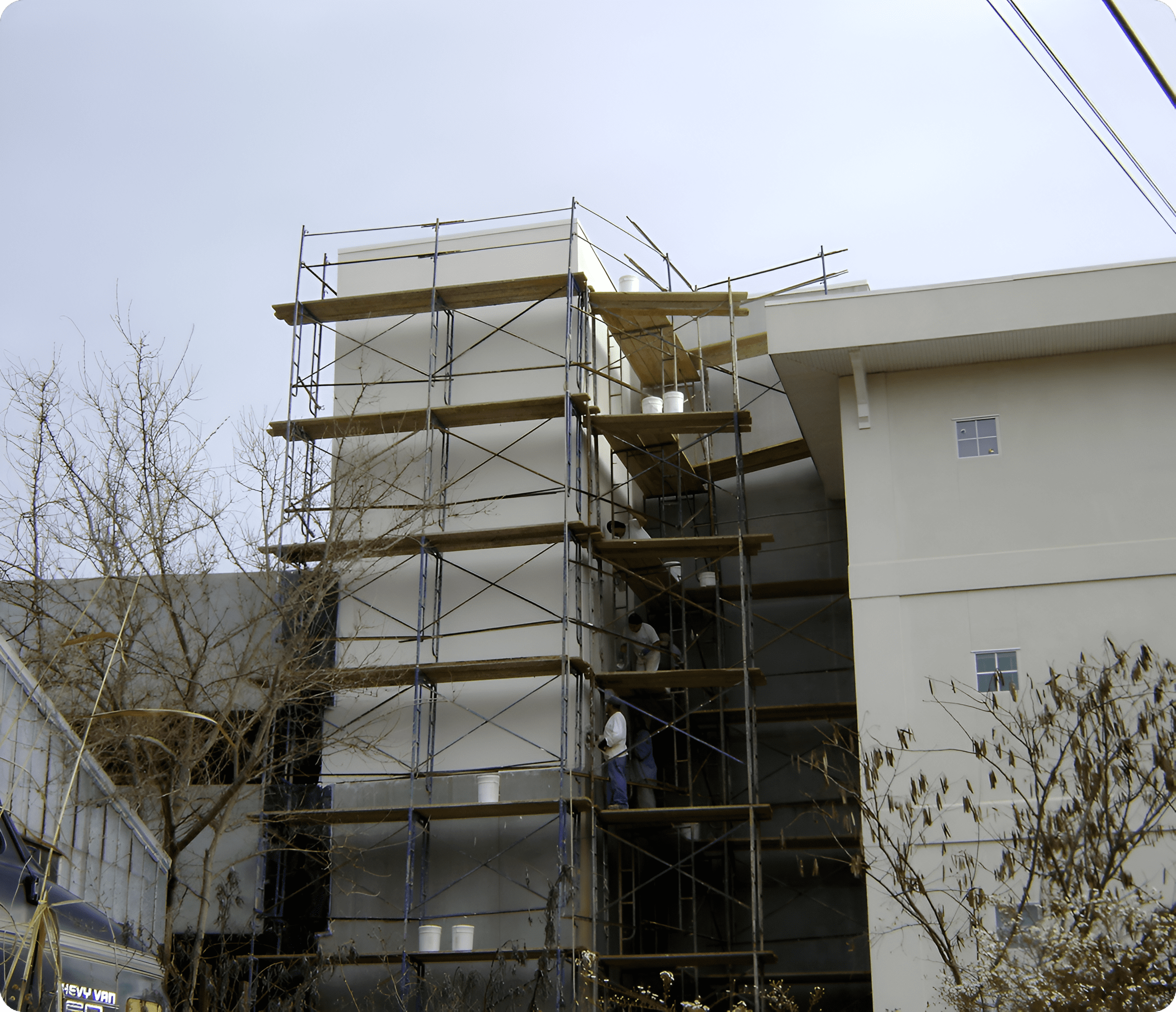 Construction workers on scaffolding structure