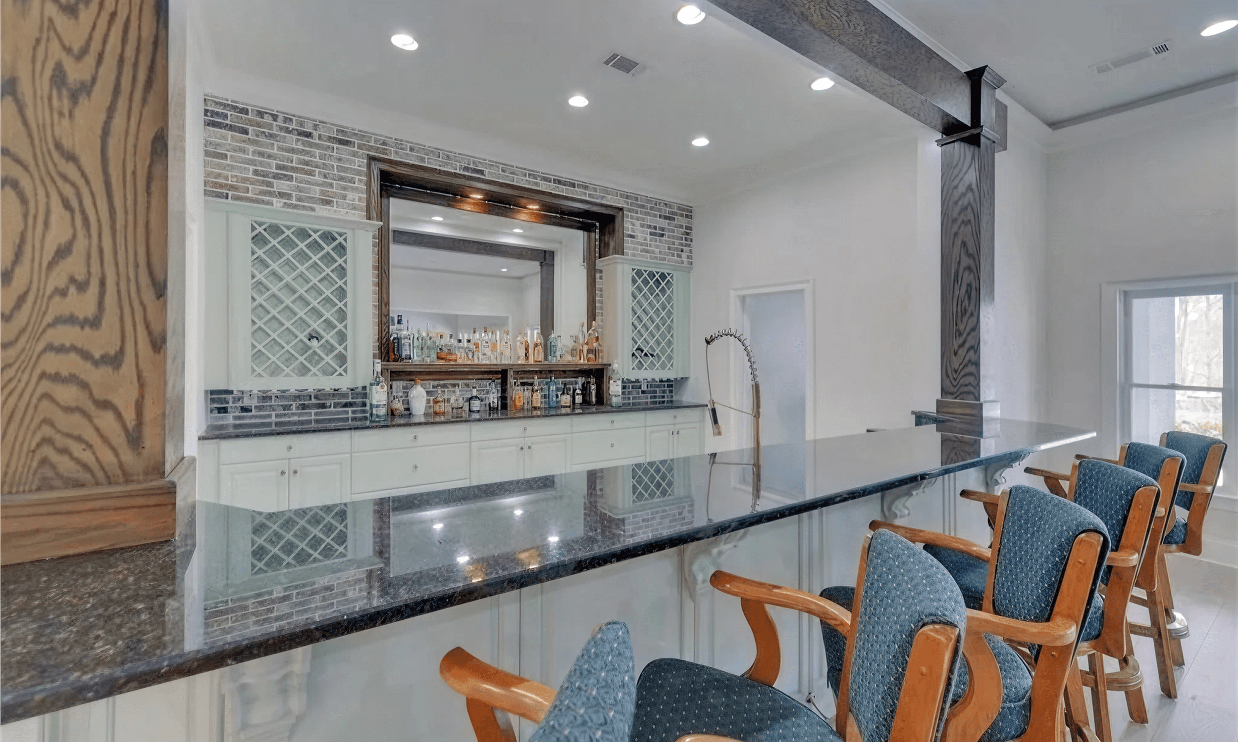 Home bar with wooden chairs